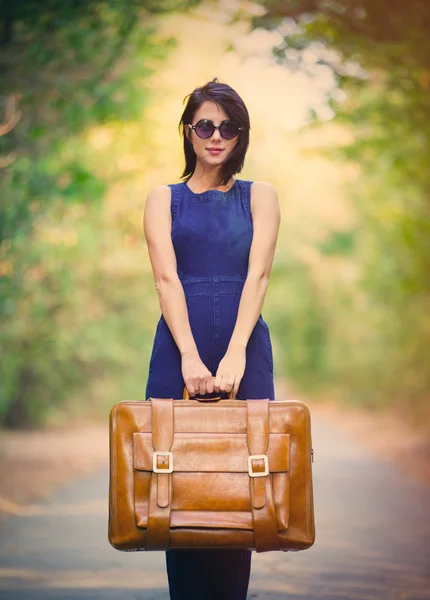 Young woman with suitcase — Stock Photo, Image