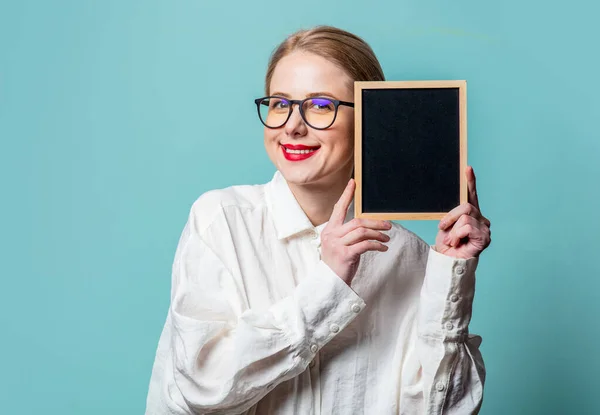 Portrait Beautiful Blonde White Shirt Blackboard Blue Background — Stockfoto