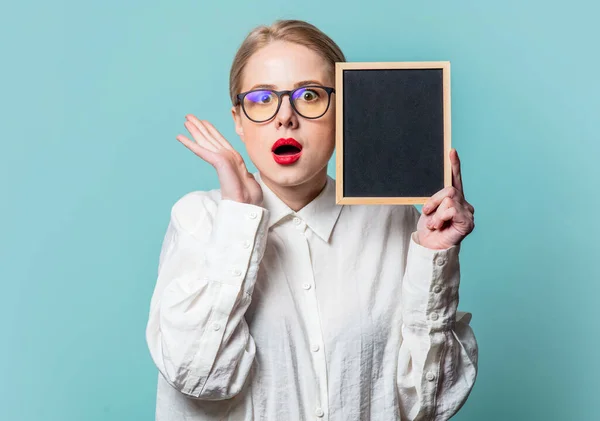 Portrait Beautiful Blonde White Shirt Blackboard Blue Background — Zdjęcie stockowe