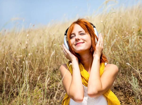 Beautiful Red Haired Girl Grass Headphones Outdoor Photo — Stock Photo, Image