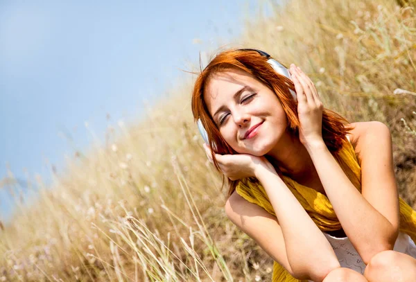 Beautiful Red Haired Girl Grass Headphones Outdoor Photo — Stock Photo, Image