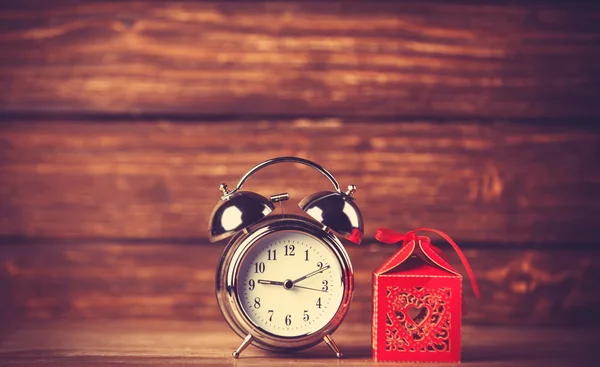 Retro alarm clock and holidays gift — Stock Photo, Image