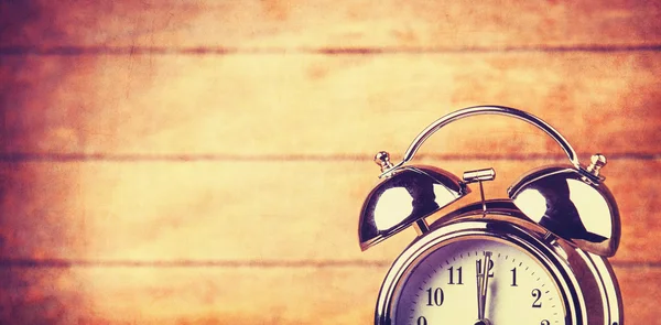 Retro alarm clock on a table — Stock Photo, Image