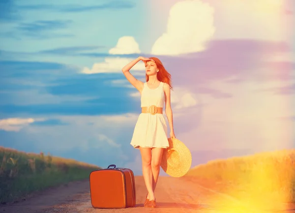 Redhead girl with suitcase at outdoor. — Stock Photo, Image