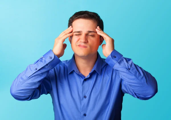 Surprised man in shirt on blue background. — Stock Photo, Image