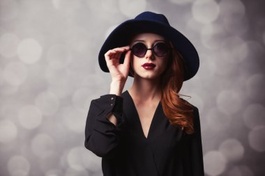 Style redhead women with sunglasses. clipart