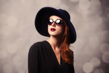 Style redhead women with sunglasses. clipart