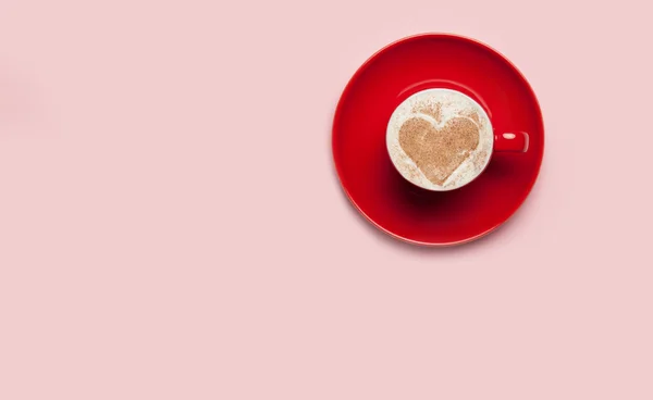 Cup of coffee with heart shape symbol on color background. — Stock Photo, Image