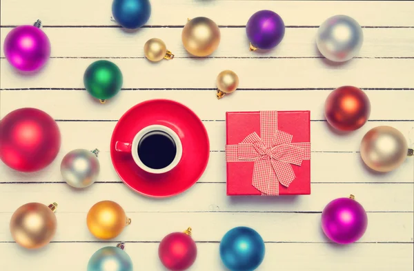 Christmas gifts toys and cup of coffee with gift. — Stock Photo, Image