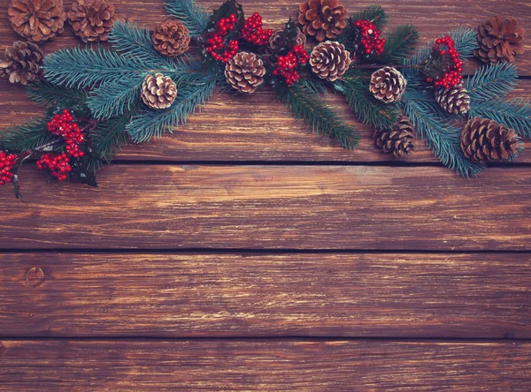 Pine branches on a wooden table. — Stock Photo, Image