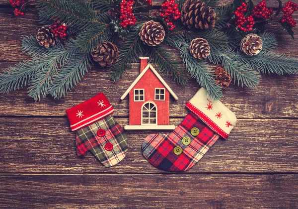 Home toy near pine branches and toys on a table — Stock Photo, Image