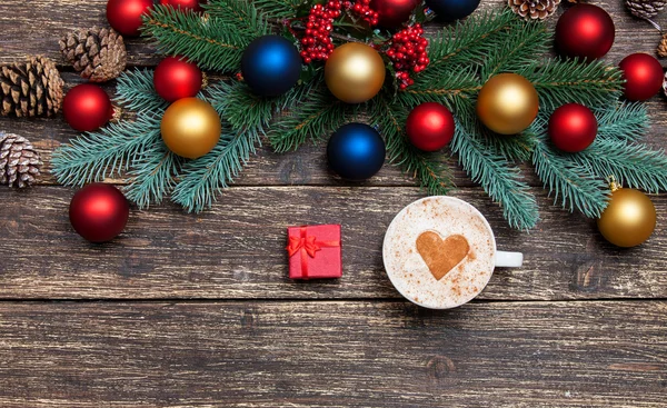 Hot cappuccino with heart shape and gift — Stock Photo, Image