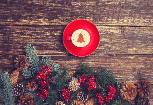 Cup of coffee with cream christmas tree on a table. — Stock Photo, Image