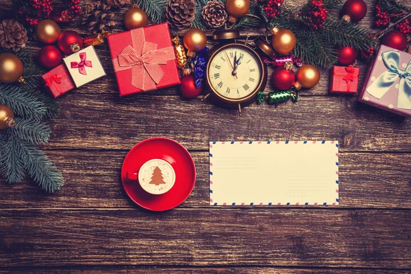 Letter and cappuccino with christmas gifts — Stock Photo, Image