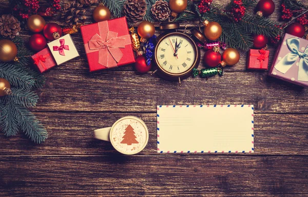 Letter and cappuccino with christmas gifts — Stock Photo, Image