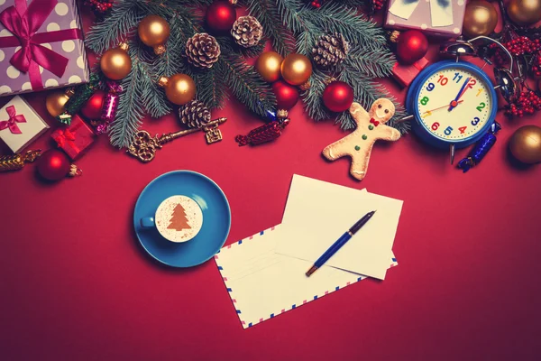 Cappuccino and letter with christmas gifts — Stock Photo, Image