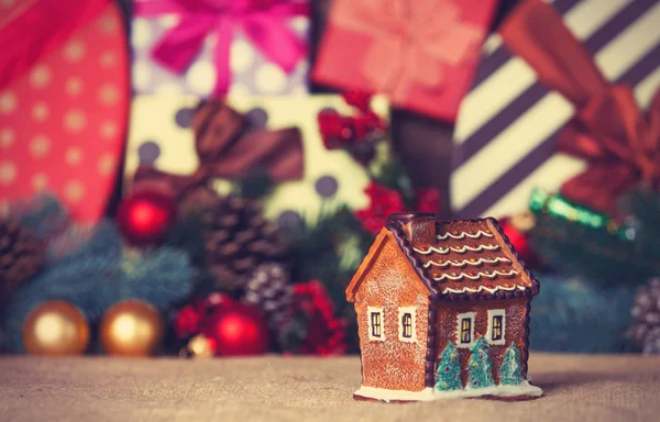 Toy house and christmas gifts — Stock Photo, Image