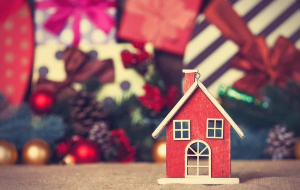 Toy house and christmas gifts — Stock Photo, Image