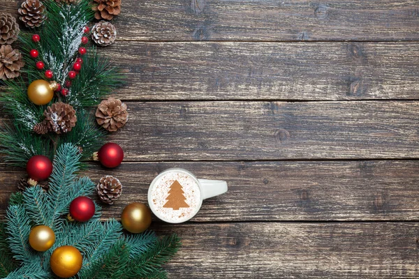 Cappuccino with christmas tree shape and pine branch on wooden t — Stock Photo, Image