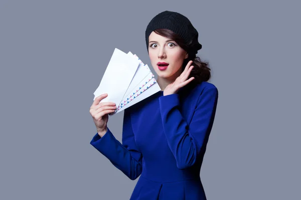 Women in blue dress with envelopes — Stock Photo, Image