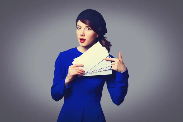 Women in blue dress with envelopes — Stock Photo, Image