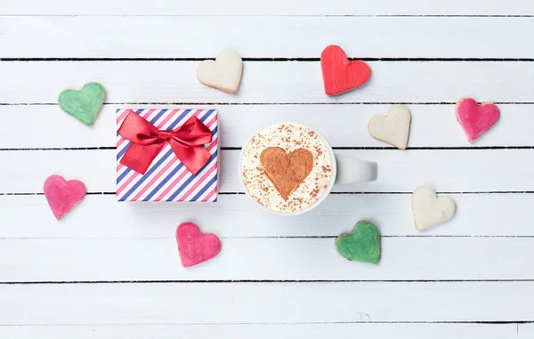 Cappuccino, cookies and gift box — Stock Photo, Image