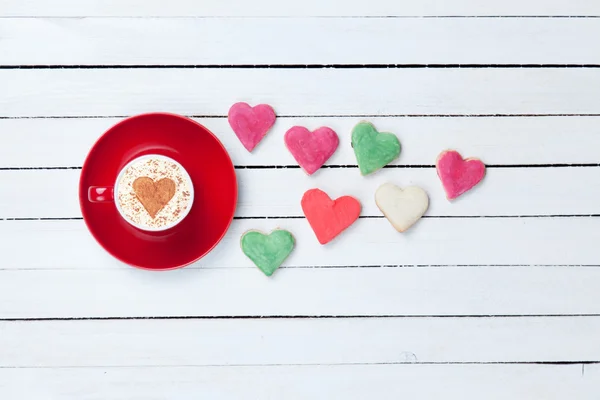 Cappuccino and cookies on white table — Stock Photo, Image