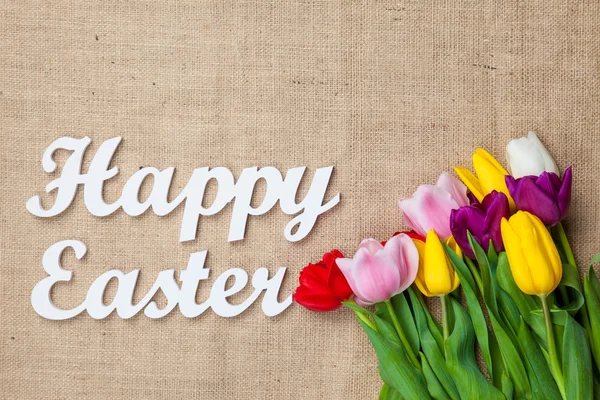 Boeket van tulpen en woorden Happy Easter — Stockfoto