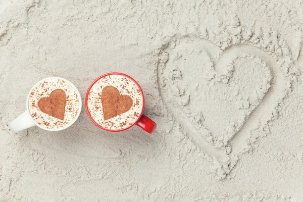 Two cups and heart shape symbol — Stock Photo, Image