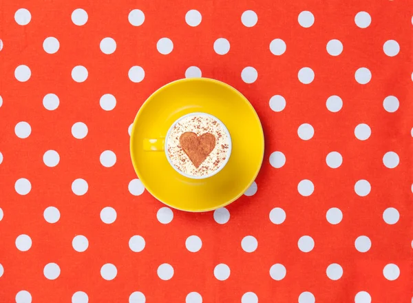 Cappuccino on polka dot background. — Stock Photo, Image