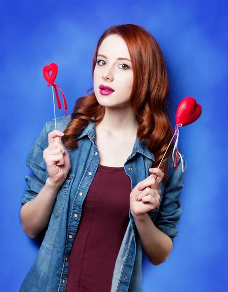 Portrait of a beautiful redhead girl with toy — Stock Photo, Image