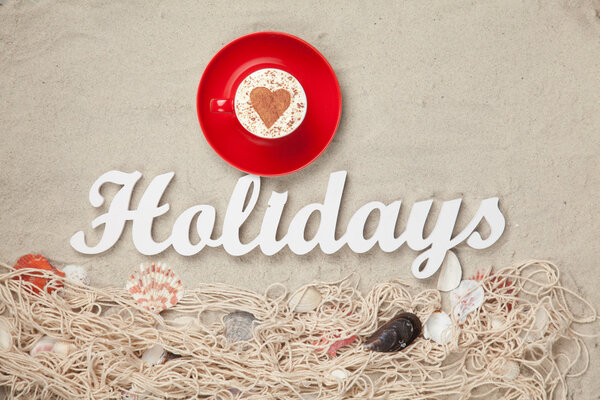 Cup and word Holidays