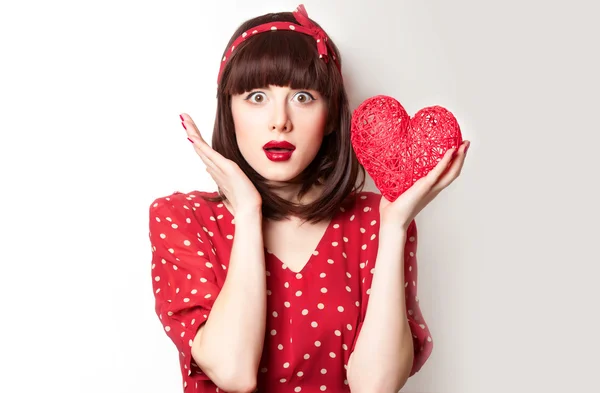 Chica en vestido rojo con juguete — Foto de Stock