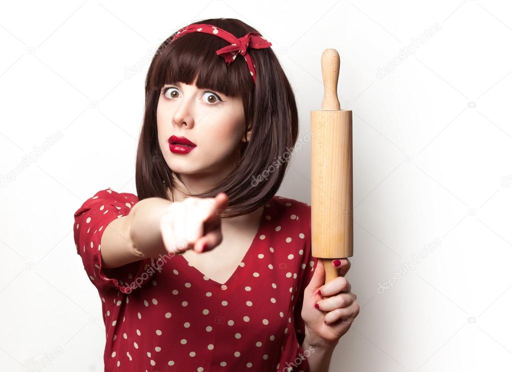 housewife red dress with rolling pin 
