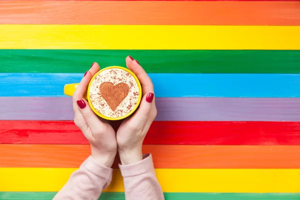 Female hands holding cup of coffee — Stock Photo, Image