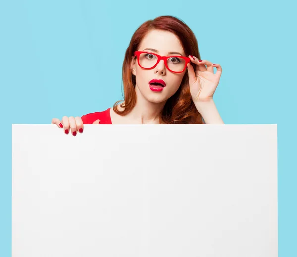 Girl in red dress and glasses with white board — Stock Photo, Image