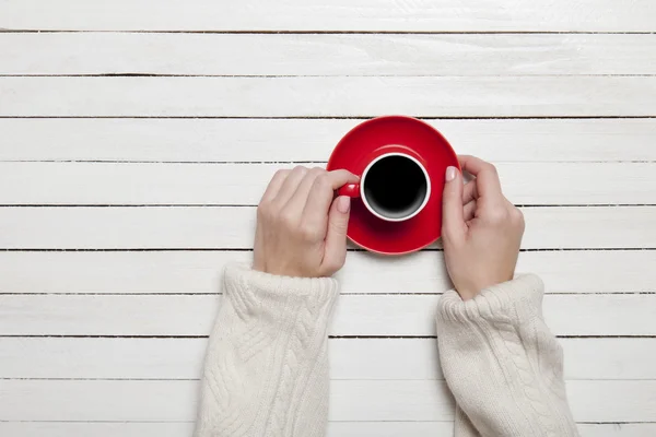 Female holding cup of coffee — Stock Photo, Image