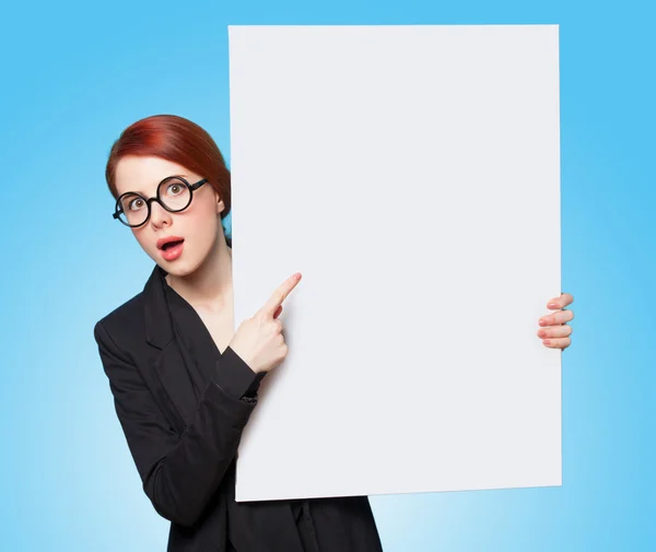 Surprised redhead women with white board — Stock Photo, Image