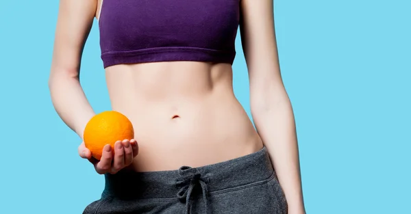 Woman showing her abs — Stock Photo, Image