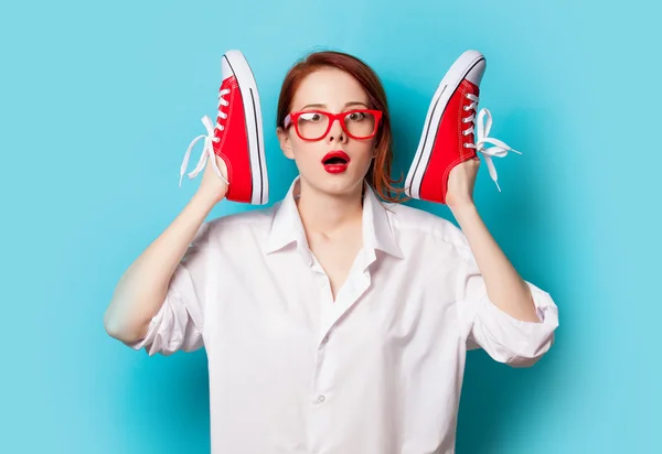 Girl in white shirt with gumshoes — Stock Photo, Image