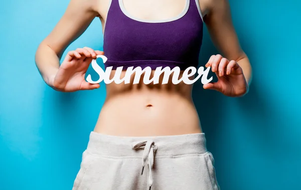 Woman showing her abs — Stock Photo, Image