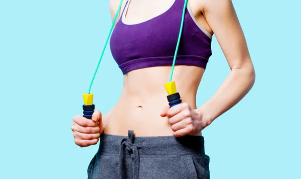 Woman showing her abs — Stock Photo, Image