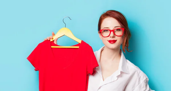 Redhead designer with red dress — Stock Photo, Image