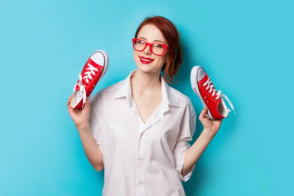 Girl in white shirt with gumshoes — Stock Photo, Image