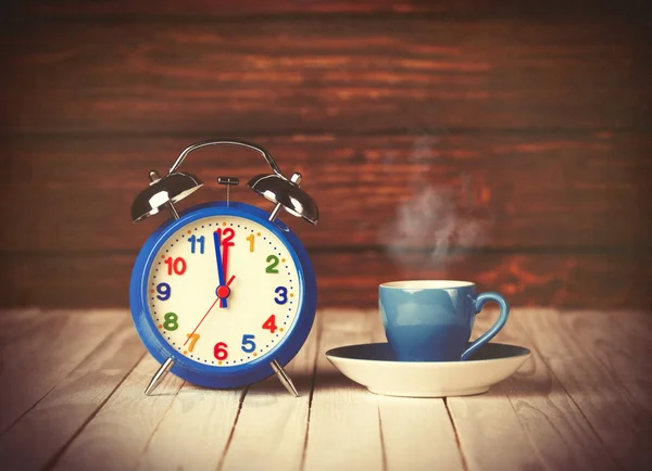 Cup of coffee and alarm clock Royalty Free Stock Images