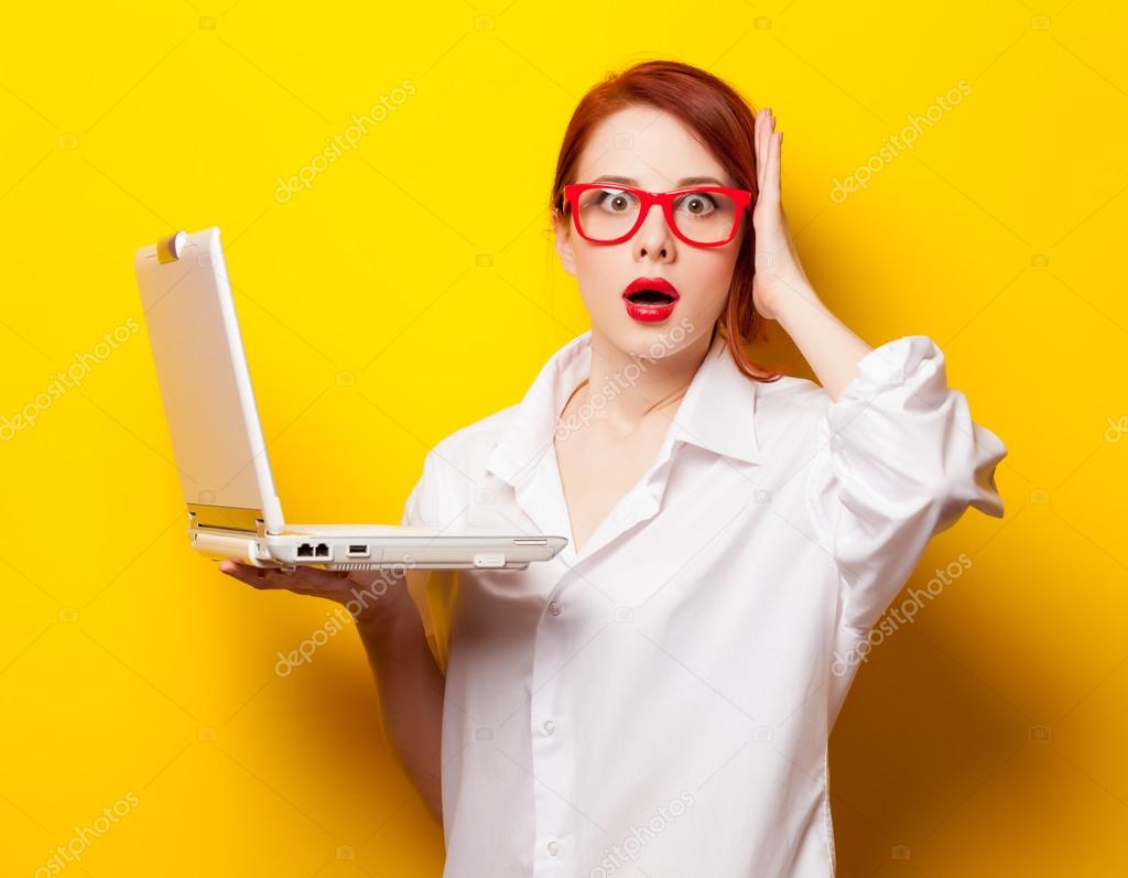 Girl in white shirt with computer