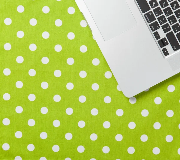 Modern laptop  on green — Stock Photo, Image