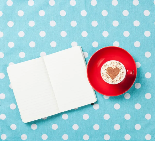 Cup of coffee and notebook — Stock Photo, Image
