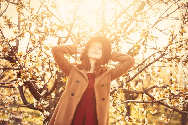 Woman in blossom apple tree garden — Stock Photo, Image