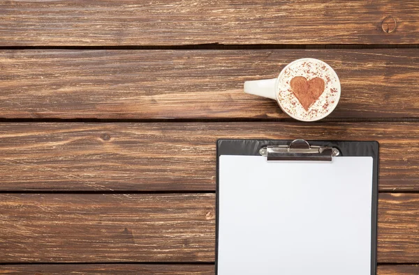 Cappuccino and business tablet — Stock Photo, Image